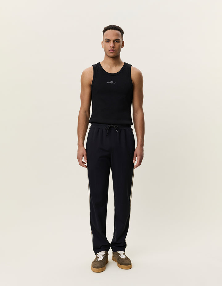 Les Deux Signature Rib Tape Track Pants in Black | Buster McGee