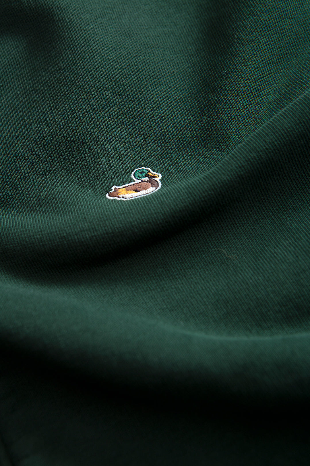 Edmmond Duck Zip in Plain Dark Green