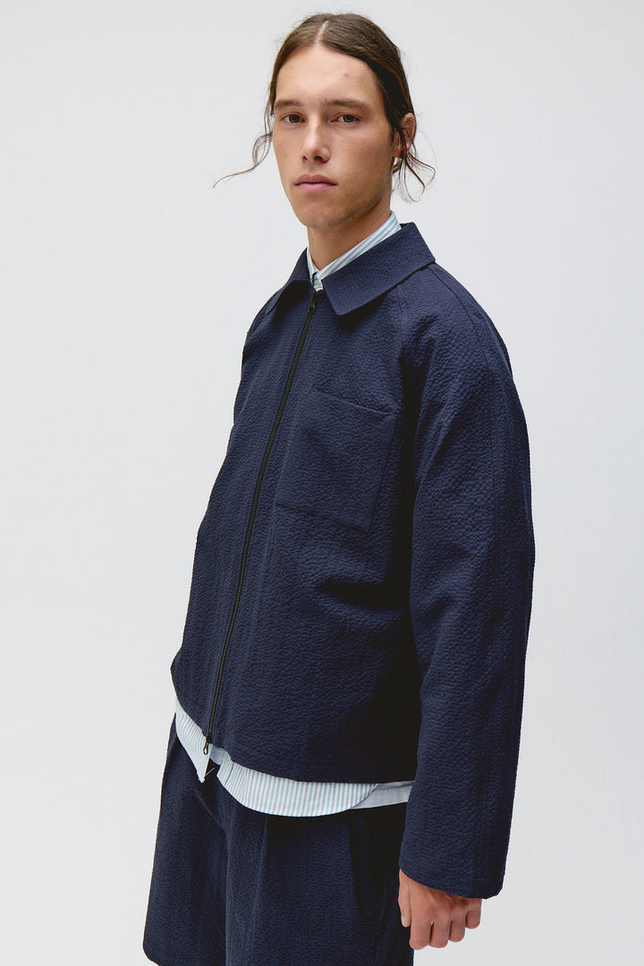 Unfeigned Our Coach Jacket in Dark Navy Seersucker | Buster McGee